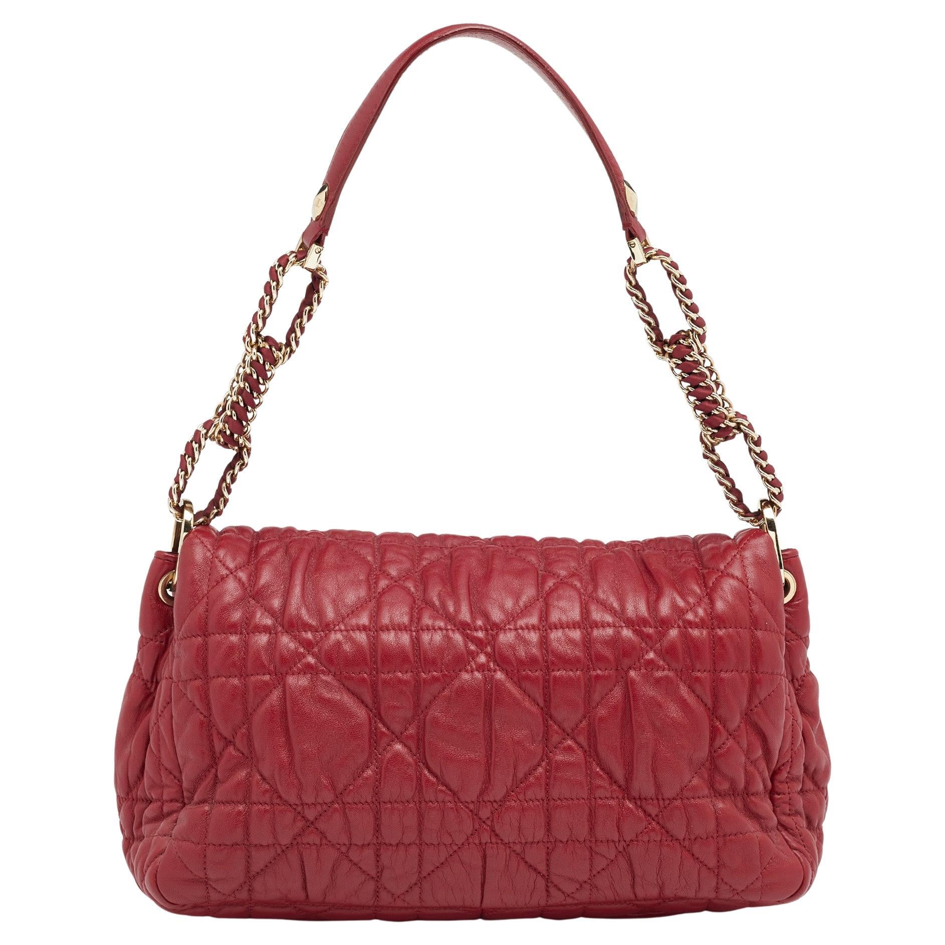 Red quilted shoulder bag detail