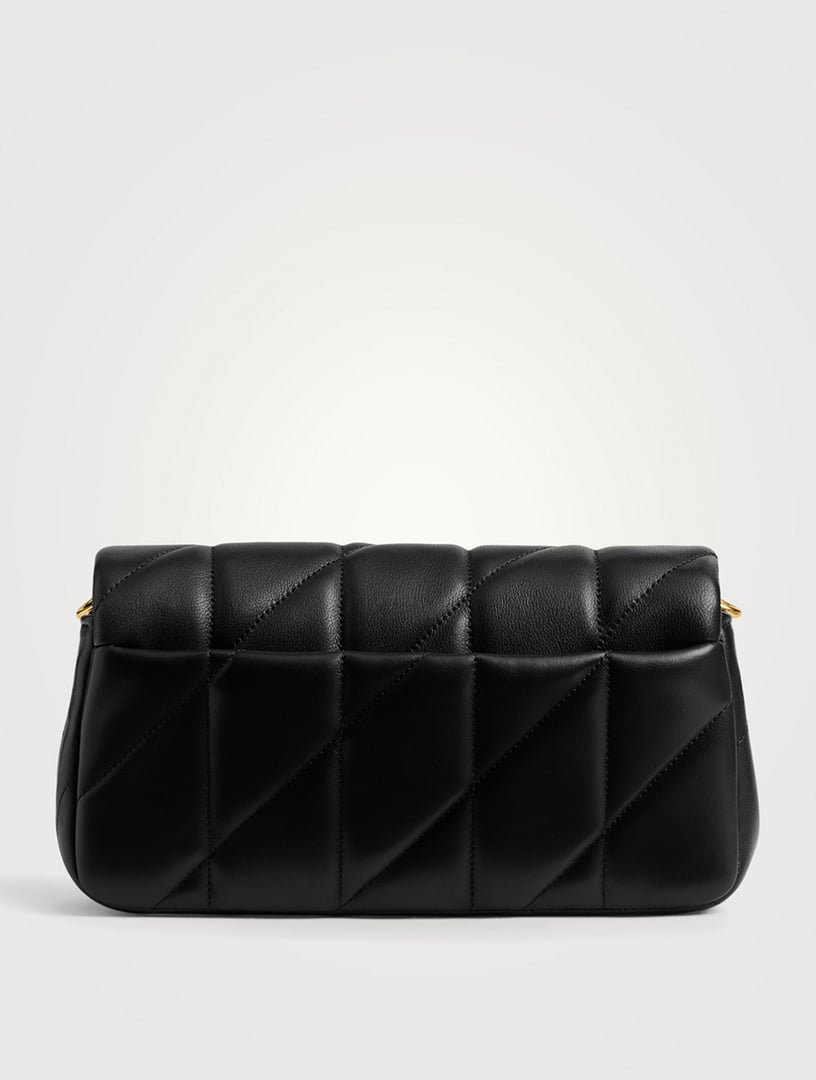 Side view of a quilted leather bag