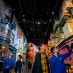 Visitors exploring the detailed Diagon Alley set at Warner Bros. Studios Japan