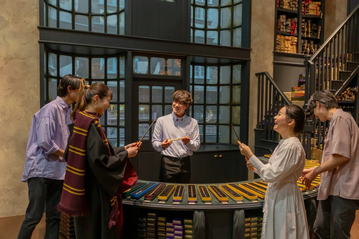 Visitors choosing a wand at Warner Bros. Studios Japan